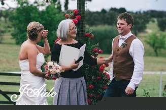 celebrant conducting wedding ceremony with bride and groom