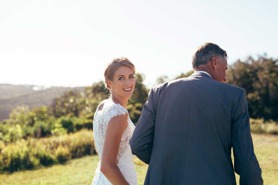 bride elegantly looking over her shoulder to her friends